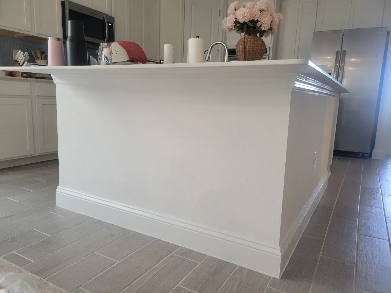 Plain white kitchen island panel before painting